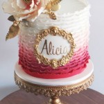 Pretty Pink Ombre Ruffled Cake with Gold Accents and Beautiful Sugar Flower