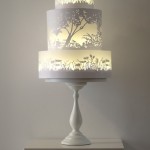 The glowing tiers of this wedding cake appear to be lit from within. Very clever painting by Rosalind Miller