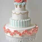 Blue, coral, white and gold vintage wedding cake