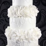 Pretty Draping Pearls and Flowers Wedding Cake