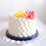 White Cake with Pink and Yellow Flowers