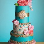 Marie Antoinette, eat your heart out. This teal and pink cake is accented with gold leaf scrolls, colored tiles and intricate flowers by Bliss Pastry