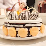 Beautiful Cake with Cream and Macaron